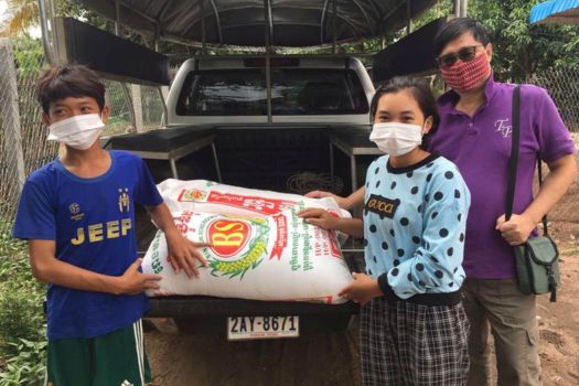Kanya receiving emergency food pack
