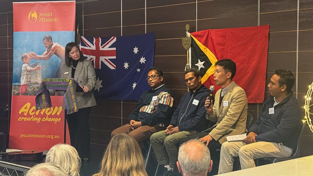 The Timorese visitors presenting on stage with Jesuit Mission Helen Forde
