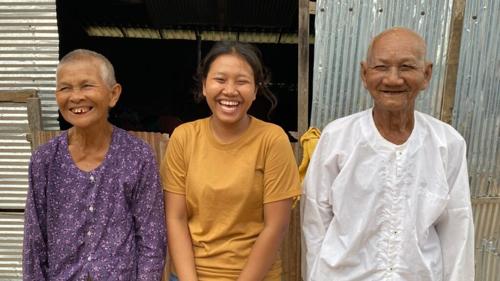 Kim laughing with her grandmother and grandfather