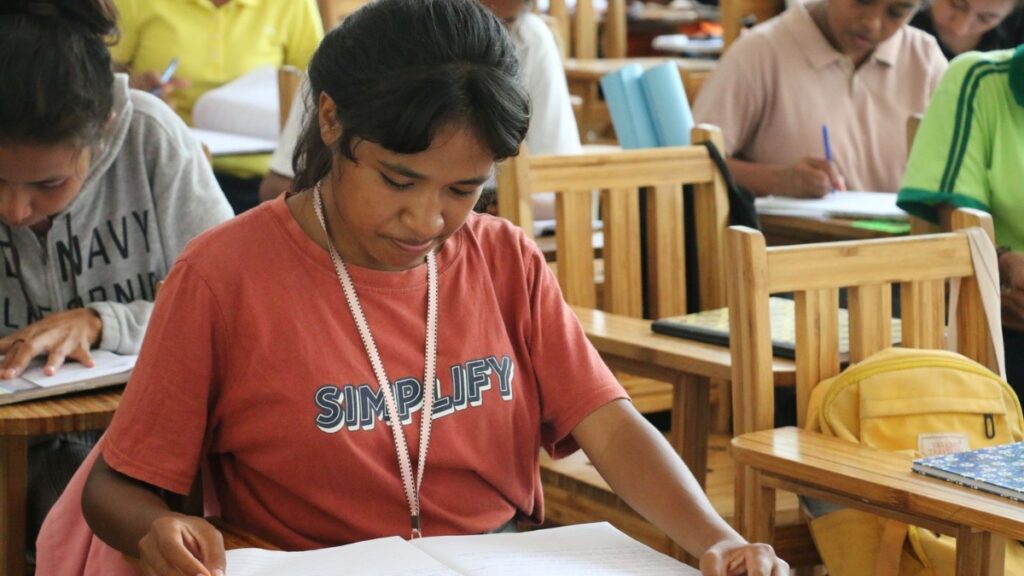 Pedrosa and her fellow students studying hard in the classroom