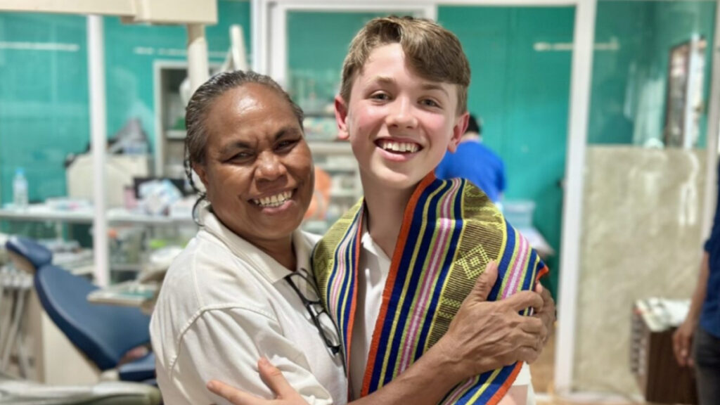 Patrick hugging Maria, who runs a dental clinic in Dili.
