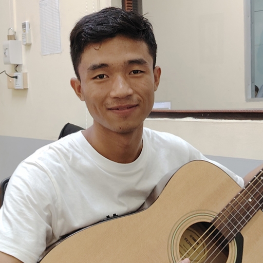 Michael playing his guitar